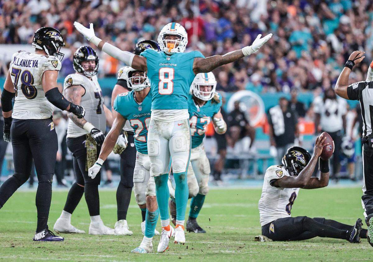 Miami Dolphins free safety Jevon Holland (8) reacts after Baltimore Ravens quarterback Lamar Jackson (8) is sacked in the second half at Hard Rock Stadium on Thursday, November 11, 2021