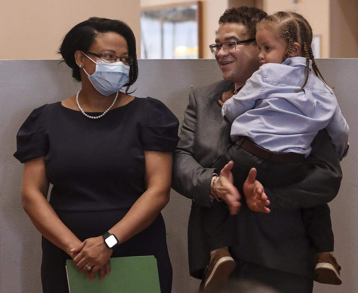 Renatha Francis, a Palm Beach County circuit judge, looks toward her husband, Phillip Fender, as he holds their son, Joshua Fender, 33 months old, after Gov. Ron DeSantis announced her appointment to the Florida Supreme Court at a press conference on Tuesday, May 26, 2020, at the Miami-Dade Public Library main branch in downtown Miami.