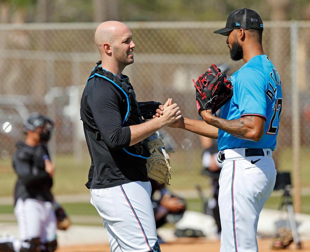 Miami Marlins pitcher Sandy Alcantara (right) shakes hands with catcher Jacob Stallings (left) after a bullpen session at Roger Dean Chevrolet Stadium in Jupiter, Florida on Thursday, February 16, 2023.