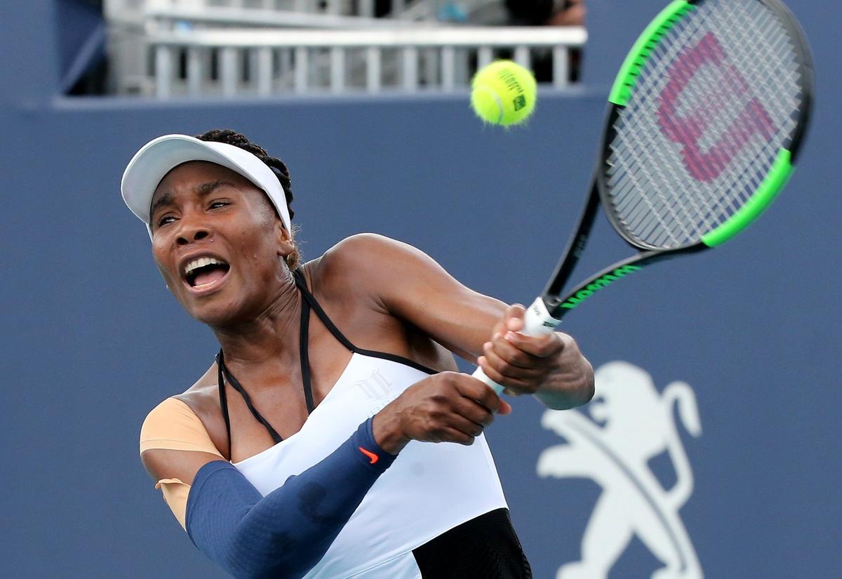 Venus Williams returns a ball hit by Daria Kasatkina 2019 at the Miami Open in Miami Gardens, Florida, Sunday, March, 24, 2019.