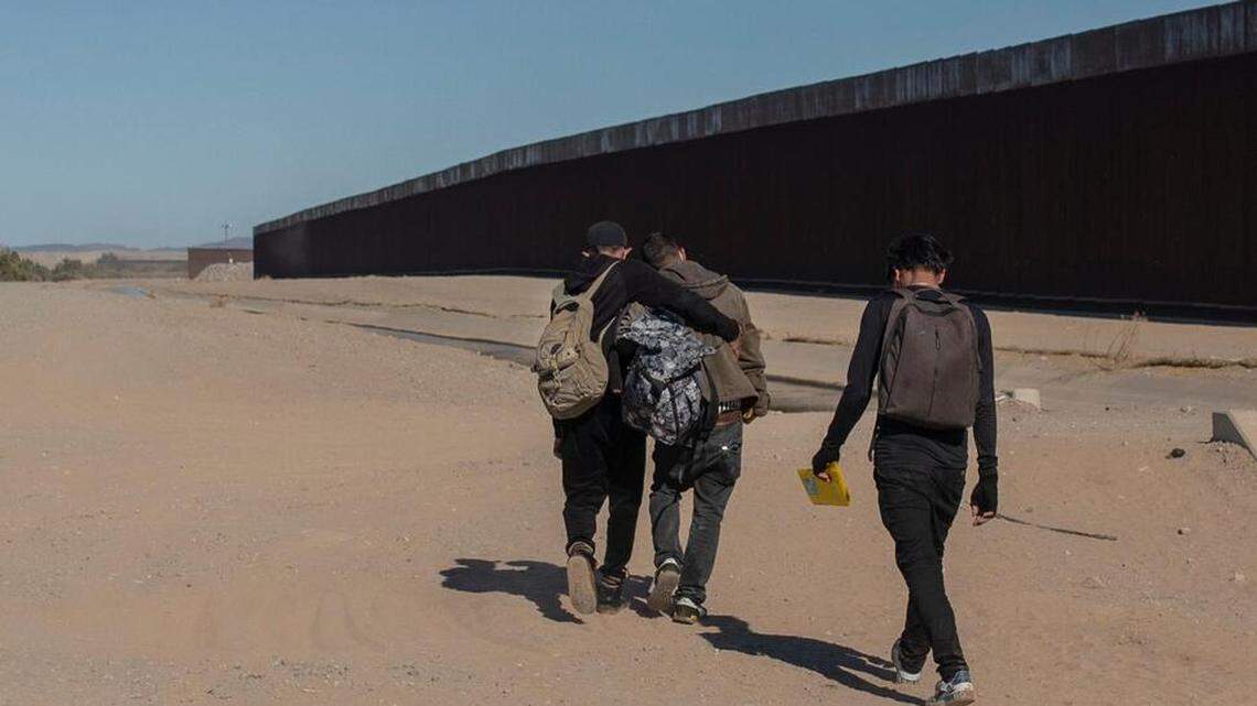 Nicaraguan migrants walk along the U.S.-Mexico border, in Algodones, Baja California, Mexico, in 2021. They entered the United States, turned themselves over to Border Patrol and asked for asylum.