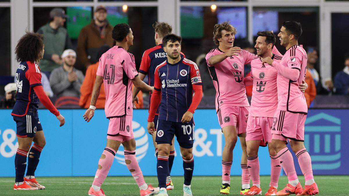 Apr 27, 2024; Foxborough, Massachusetts, USA; Inter Miami CF midfielder Benjamin Cremaschi (30) and forward Luis Suarez (9) and midfielder Lionel Messi (10) and midfielder David Ruiz (41) celebrate after a goal as New England Revolution forward Carles Gil (10) walks away in the second half at Gillette Stadium. Mandatory Credit: Paul Rutherford-USA TODAY Sports
