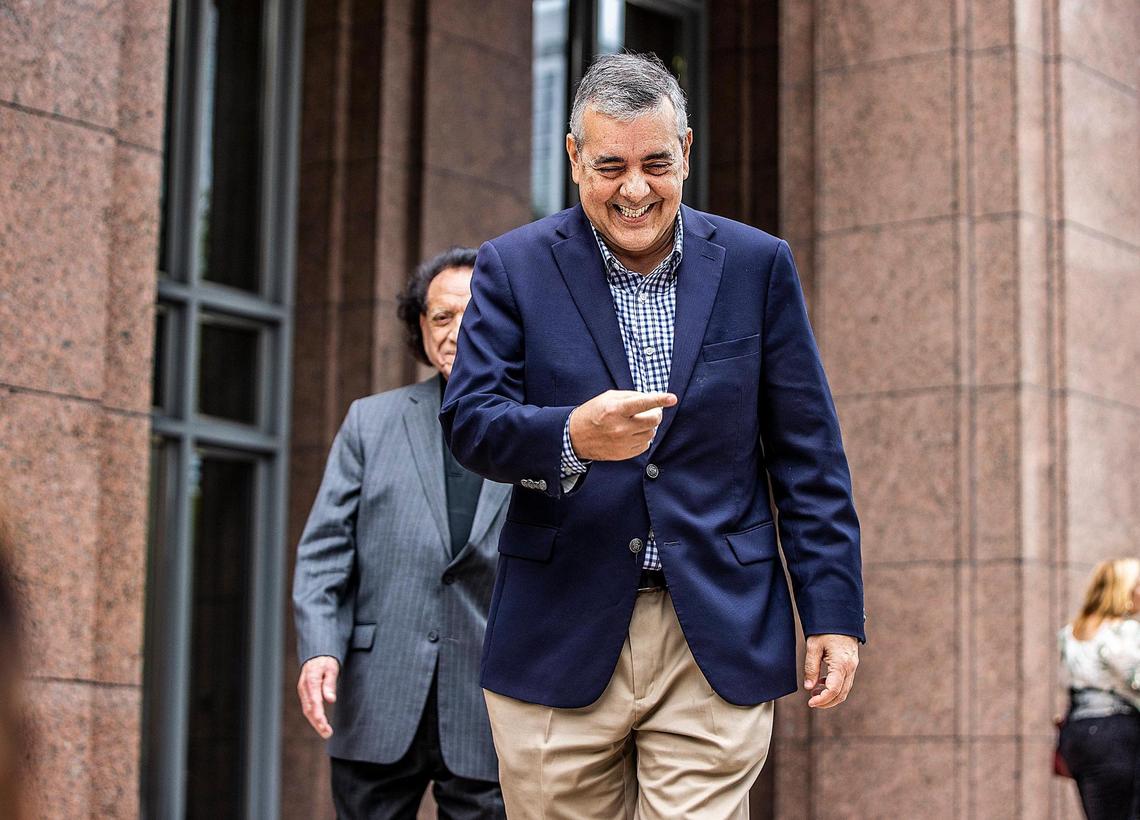 Former U.S. Rep. David Rivera (right) walks out of court after his first federal court appearance before Magistrate Judge Jonathan Goodman at the James Lawrence King Criminal Justice Building in Miami, on Tuesday, Dec. 20, 2022.