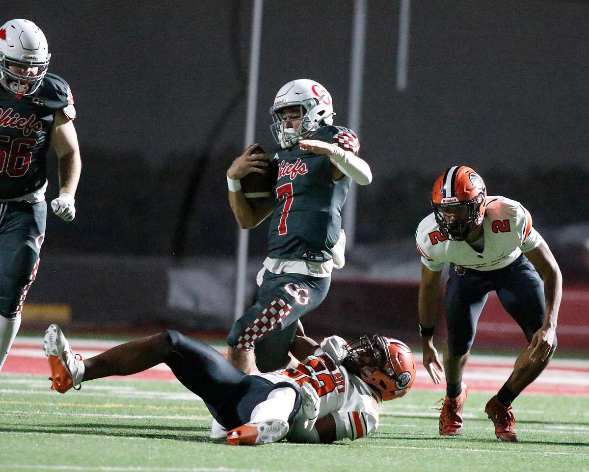 Cardinal Gibbons Chiefs quarterback Jayden Torres (7) is taken down by Carol City Chiefs defender during regional quarterfinal football game on Friday, November 15, 2024 at Cardinal Gibbons HS in Fort Lauderdale. Andrew Uloza / for Miami Herald