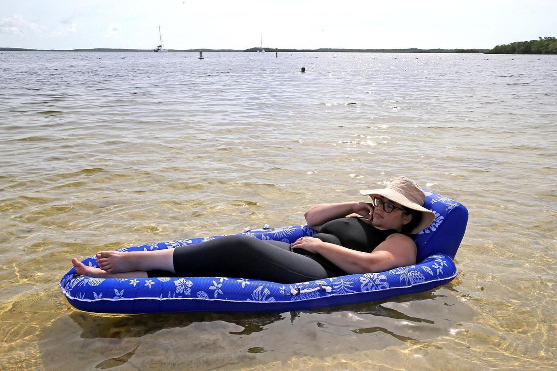 Melissa McGuire, from Orlando, lies in a float at John Pennekamp State Park in Key Largo, Florida, June 1, 2020. The Florida Keys reopened to tourist after being closed because of the coronavirus outbreak.