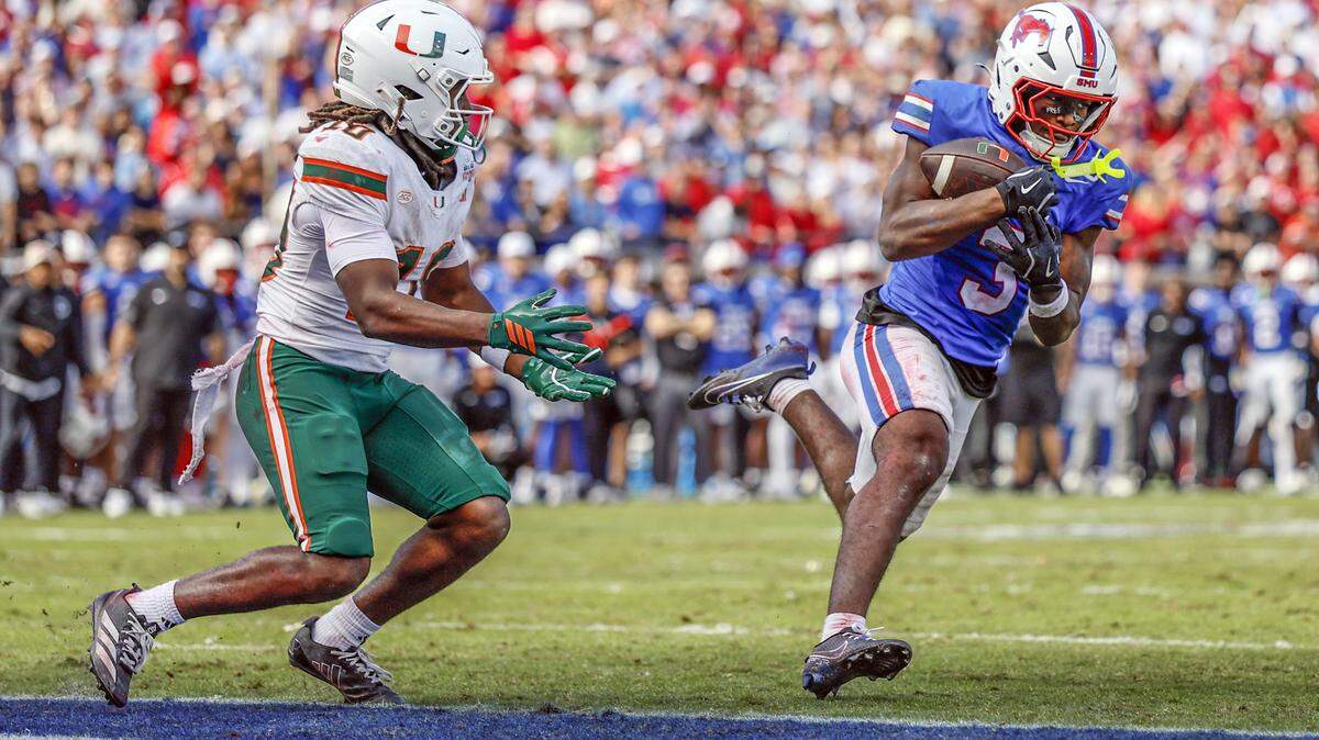 Southern Methodist University Mustangs safety Ahmaad Moses (3) intercepts a pass intended for Miami Hurricanes wide receiver Malachi Toney (10) in overtime during an NCAA football game at Gerald Ford Stadium on Saturday, November 1, 2025, in Dallas, Texas.