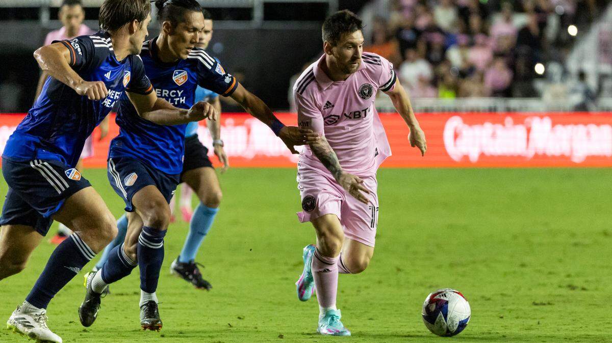 Inter Miami forward Lionel Messi (10) dribbles with the ball as FC Cincinnati forward Yuya Kubo (7) defends in the second half of their MLS match at DRV PNK Stadium on Saturday, Oct. 7, 2023, in Fort Lauderdale, Fla. The team will play a pair of friendly matches in China on early November.
