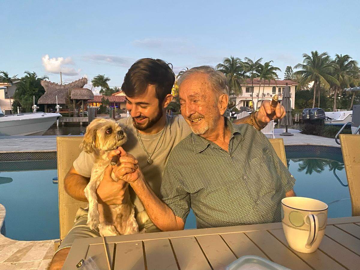 Nick Fusco and his late grandfather, Gonzalo Torre, smoke cigars together.