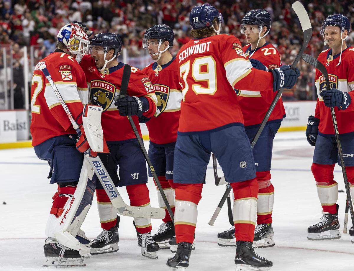 Florida Panthers goaltender Sergei Bobrovsky (72) celebrates with left wing Brad Marchand (63) after they defeated the Dallas Stars in their NHL game at Amerant Bank Arena on Saturday, Nov. 1, 2025, in Sunrise, Fla.