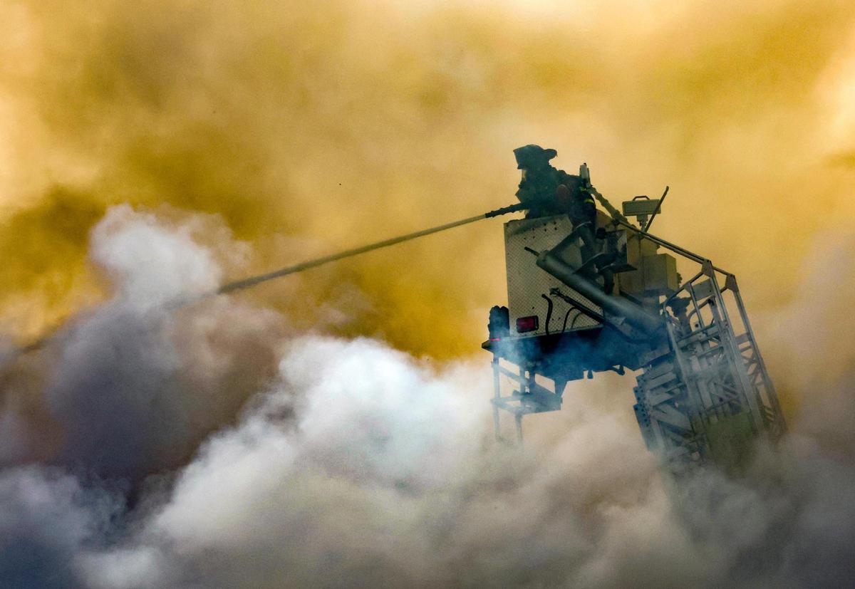 Miami-Dade Fire Fighters battle a blaze at a two-story apartment building at 395 NW 177 Street on Saturday morning, Jan. 28, 2023.