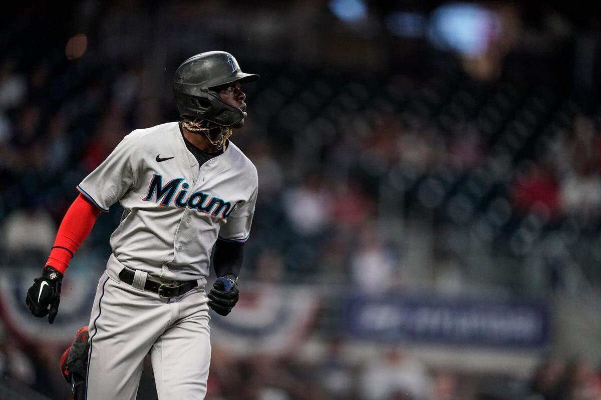Miami Marlins’ Jazz Chisholm Jr. watches his home run during the third inning of the team’s baseball game against the Atlanta Braves on Wednesday, April 14, 2021, in Atlanta.