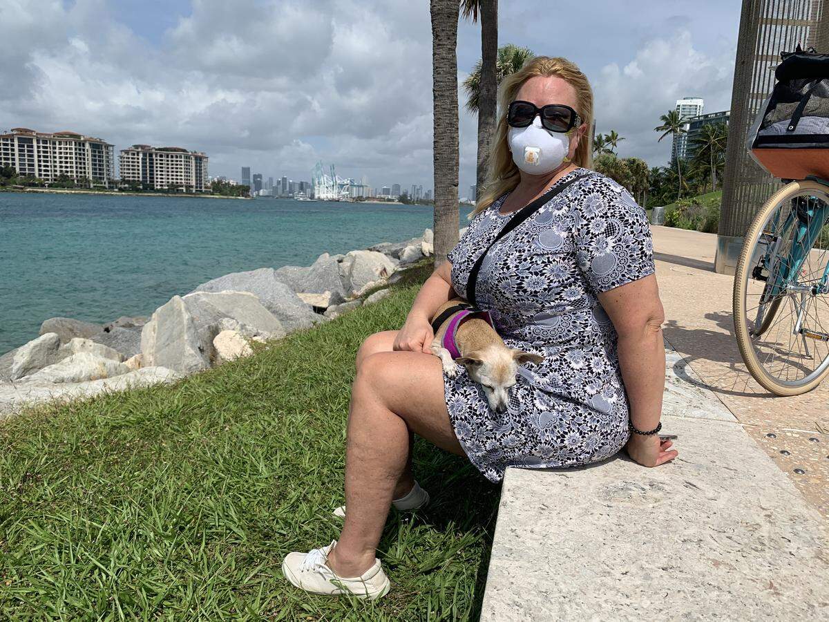 Dianne McLea and her 18-year-old dog, Lucky Lou, visited South Pointe Park in Miami Beach on Wednesday morning, the first day that parks and boat ramps opened up in Miami-Dade County.
