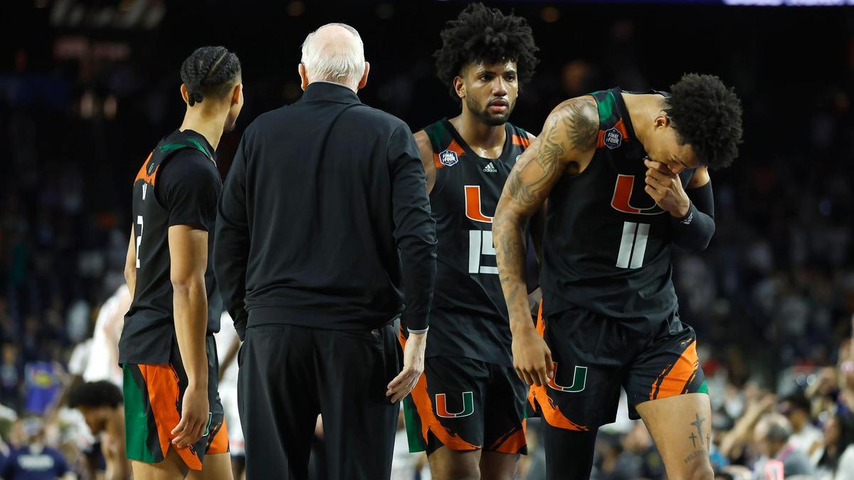 Miami Hurricanes players Jordan Miller (11) Norchad Omier (15) and Isaiah Wong (2) walk by Hurricanes head coach Jim Larranaga looks on during the second half of the Men’s Basketball Championship National Semifinal against the Connecticut Huskies at NRG Stadium in Houston, Texas on Saturday, April 1, 2023.