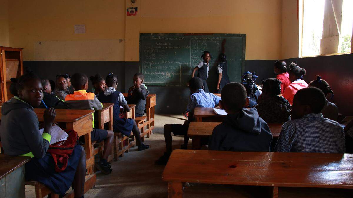 Children in Kenscoff, Haiti, returned to this school after a long period of socioeconomic unrest that forced them to stay home since the academic year started in September. About 60 percent of schools have now reopened nationwide, the UN’s World Food Program said.