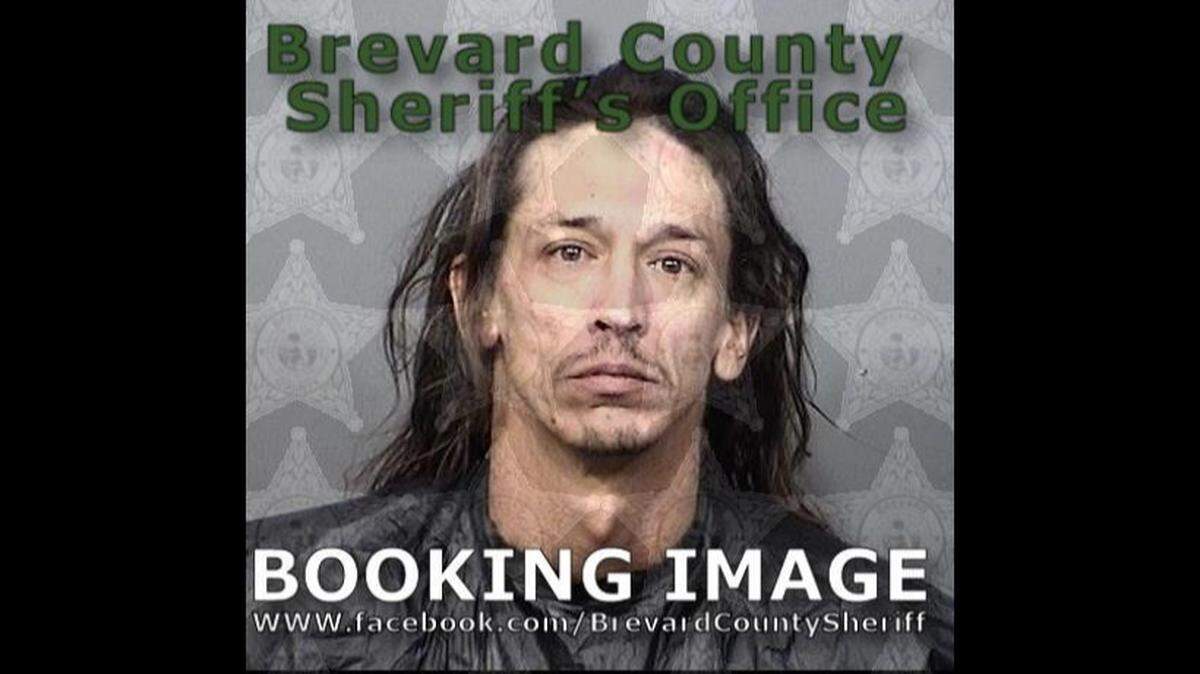 Police said Lawrence Kiehart fled with a child to a garage attic for four hours, trying to avoid arrest after he made 39 calls to a woman he is accused of harming and texted her numerous times.