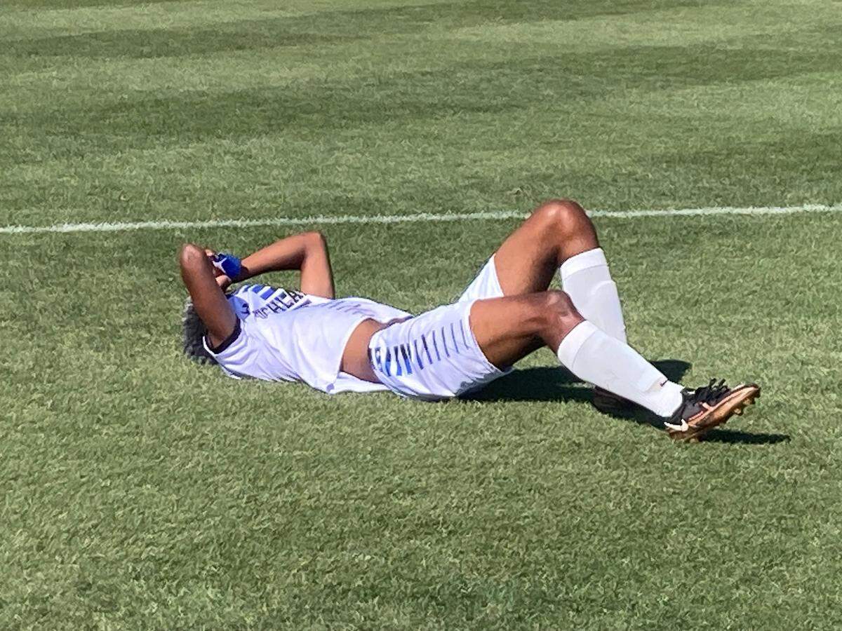 Highlands Christian’s Braden Francis lies on the ground after the Knights lost to Pine School on Wednesday in a Class 1A boys’ soccer state semifinal.