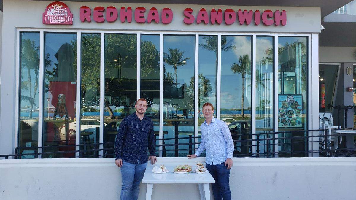 The Mounayyer brothers at their new sandwich shop on Ocean Drive.