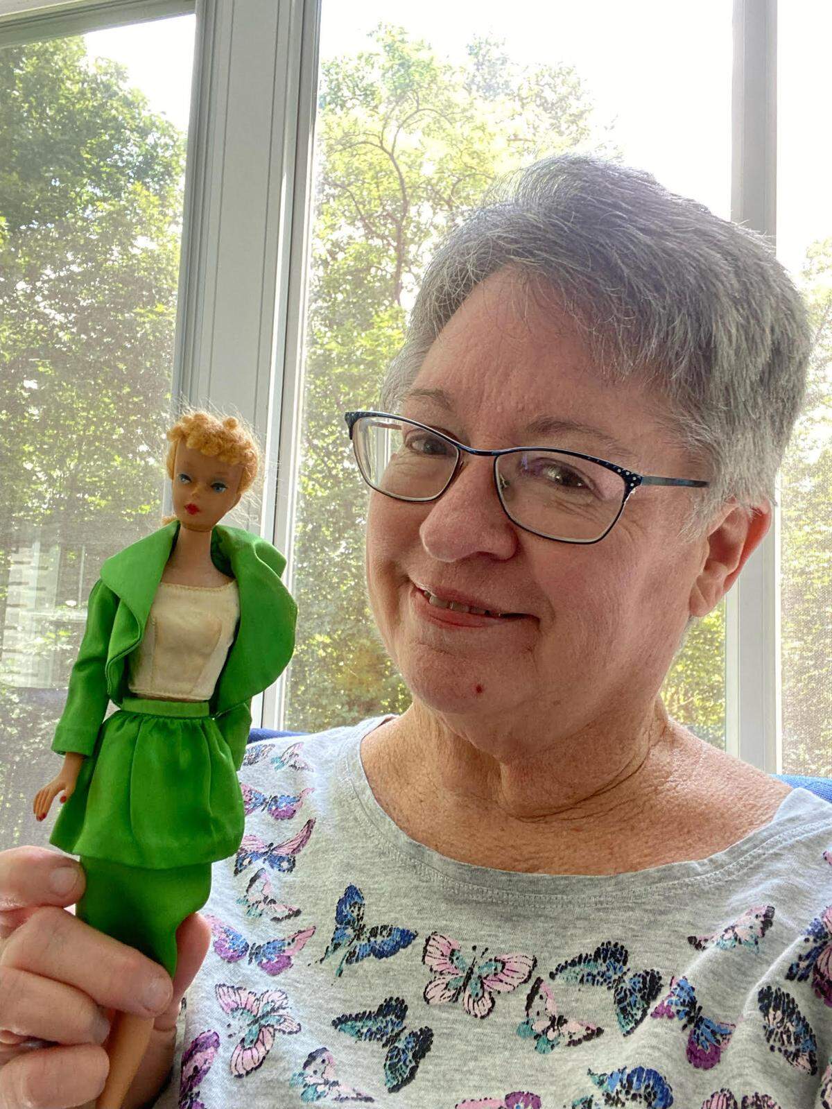 Barbara Tomson remembers getting her first Barbie doll in the toy department of the Sears store on the intersection of Douglas Road and Coral Way in 1959 when she was 6 and lived in Miami. She’s now 71, living in North Carolina, and still has the doll and shows it here from her home.