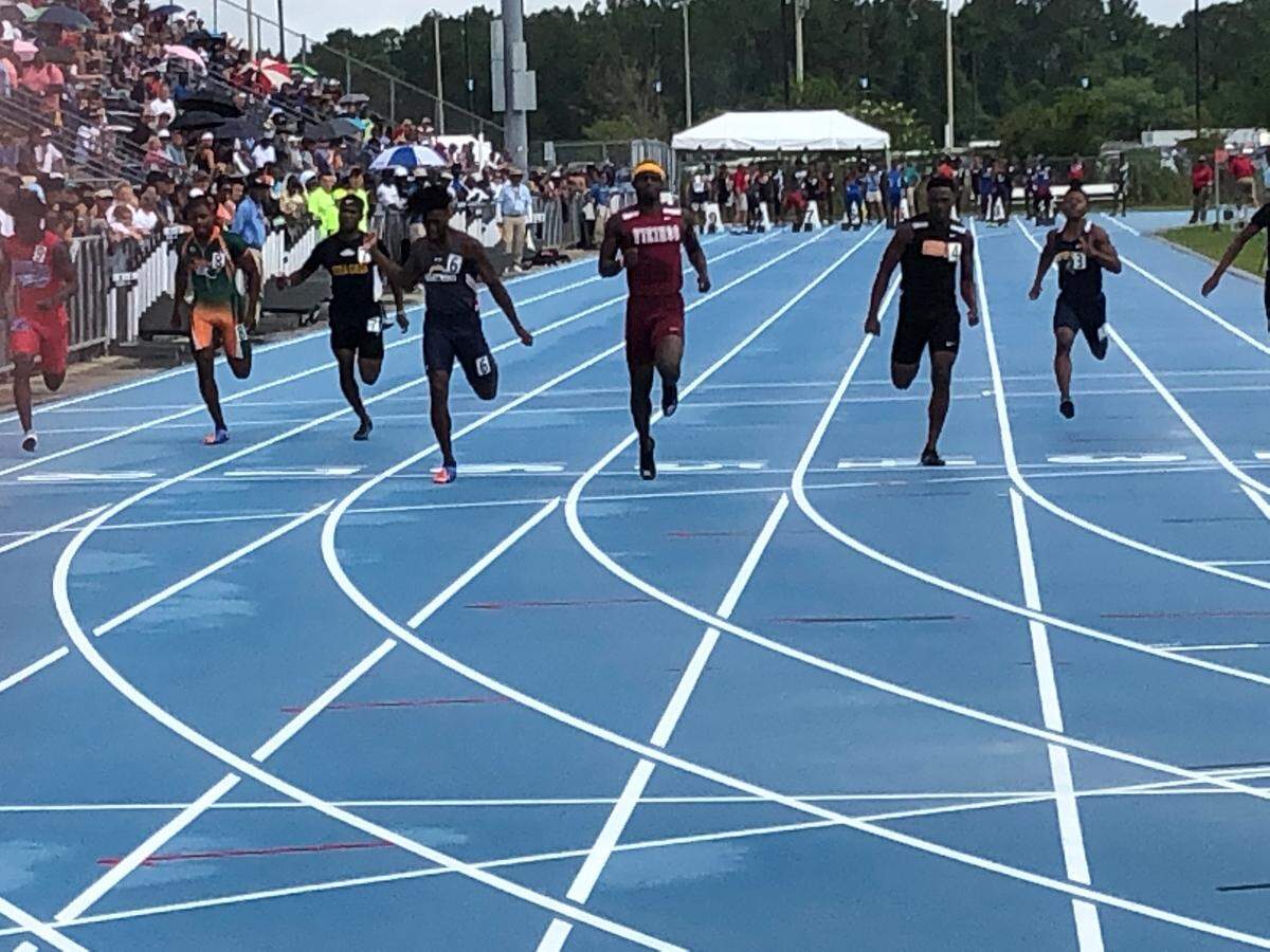 Tyrese Cooper of Miami Norland (Lane 5) wins his heat in the Class 3A 100-meter dash prelims with the fastest qualifying time of 10.69 at FHSAA Track and Field Championships at the University of North Florida in Jacksonville on Friday. Finals are set for Saturday.