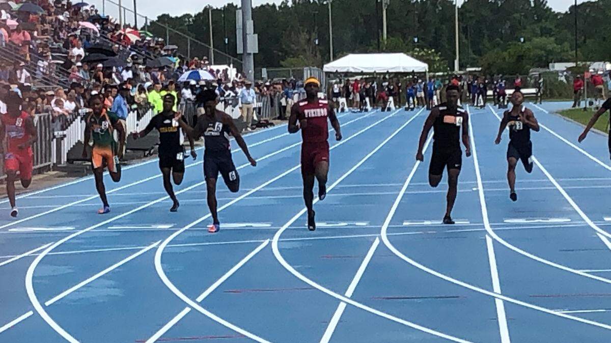 Tyrese Cooper of Miami Norland (Lane 5) wins his heat in the Class 3A 100-meter dash prelims with the fastest qualifying time of 10.69 at FHSAA Track and Field Championships at the University of North Florida in Jacksonville on Friday. Finals are set for Saturday.