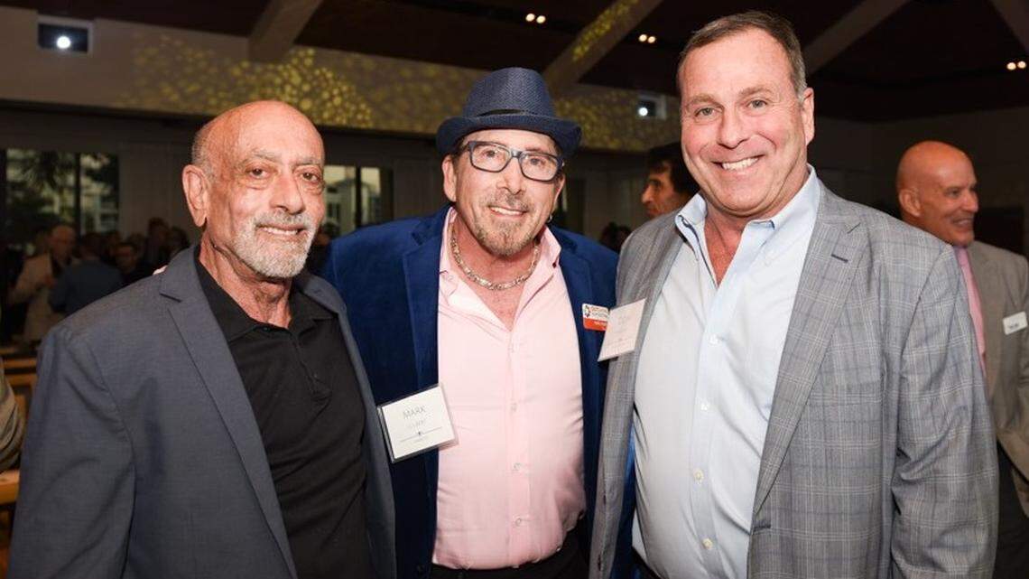 Commitment to a Cause Award recipient Mark Gilbert, center, with Our Fund board members Scott Bennett, left, and Don Hayden, at the second annual South Florida LGBT Philanthropy Awards hosted by Our Fund Foundation and Bank of America Private Bank. 
