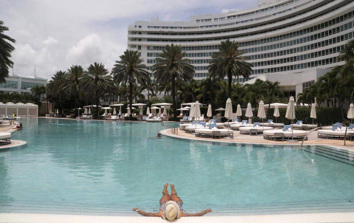A hotel guest enjoys having the pool practically to herself at Fontainebleau Miami Beach. The hotel re-opened on June 1 after having to shut down due to the coronavirus pandemic.