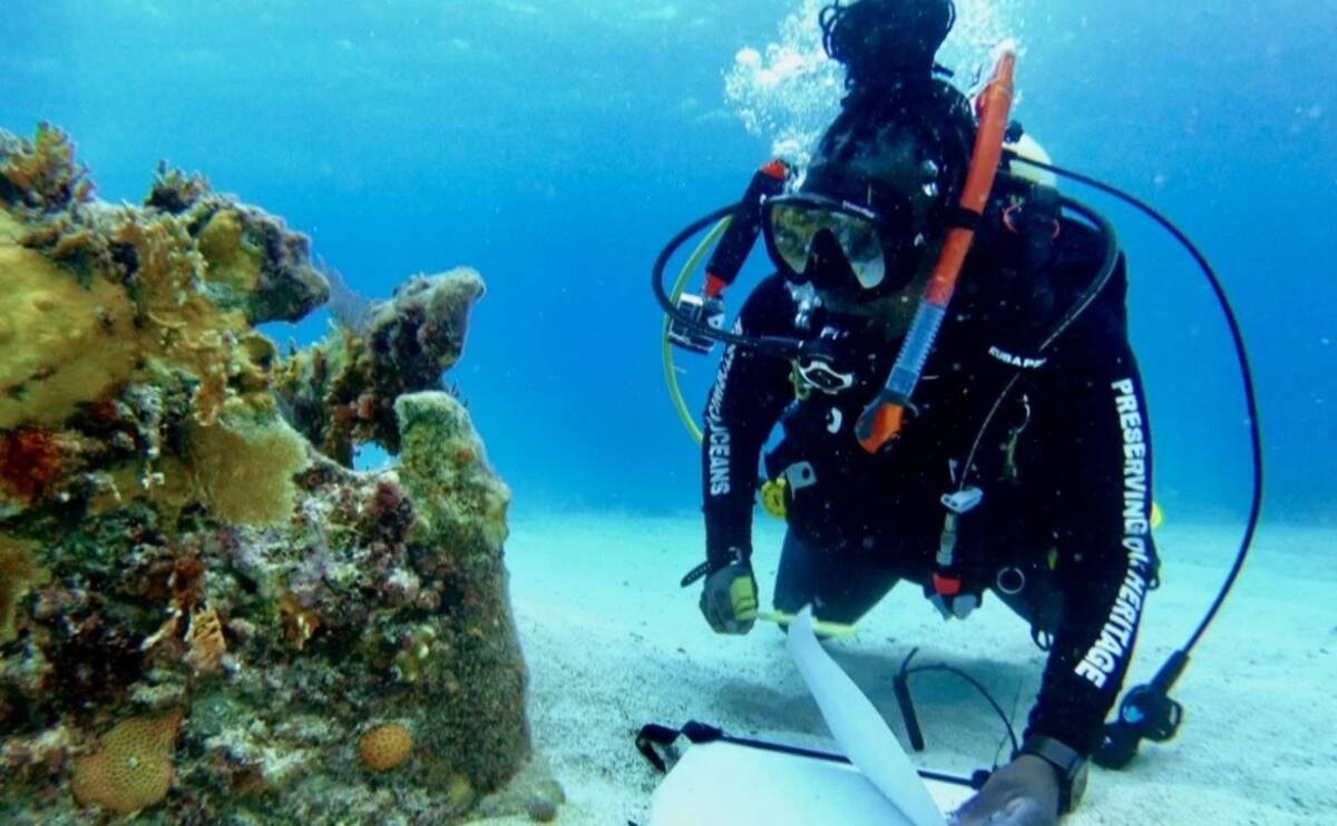 Shellie Baxter examines a portion of the Porter Anchor Wreck.