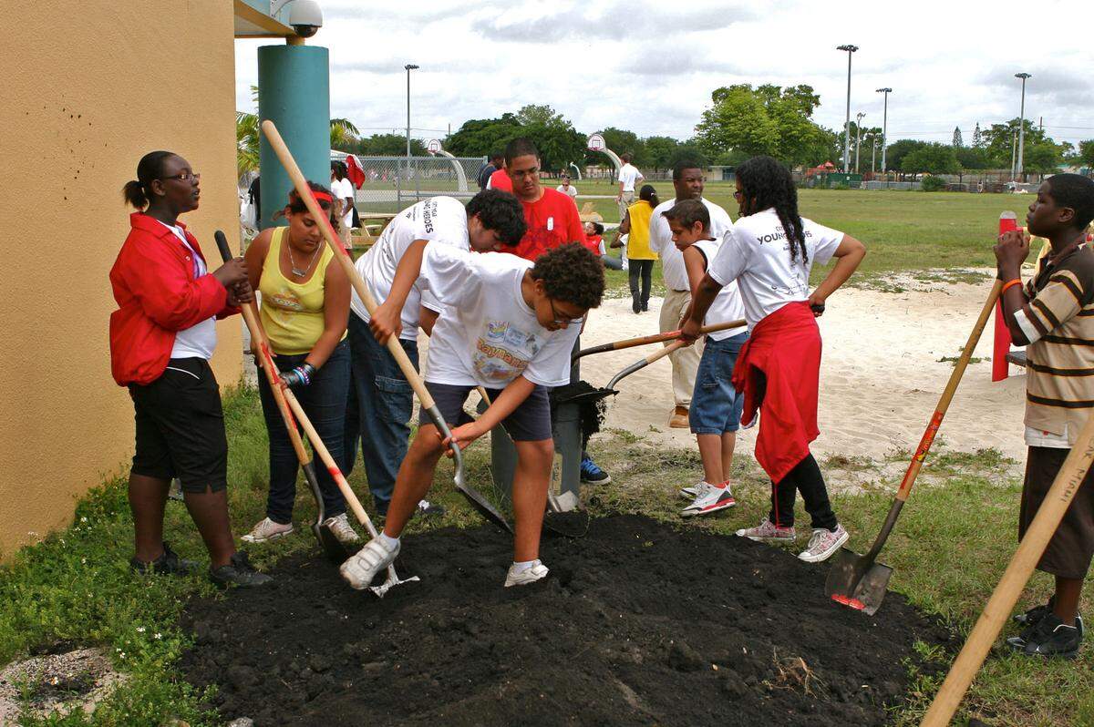 Middle school students from all over Miami-Dade County teamed up to plant a garden at Myrtle Grove Elementary School in Miami Gardens, Saturday, May 22, 2010, as part of the Young Heroes program in which young people take action on community needs.