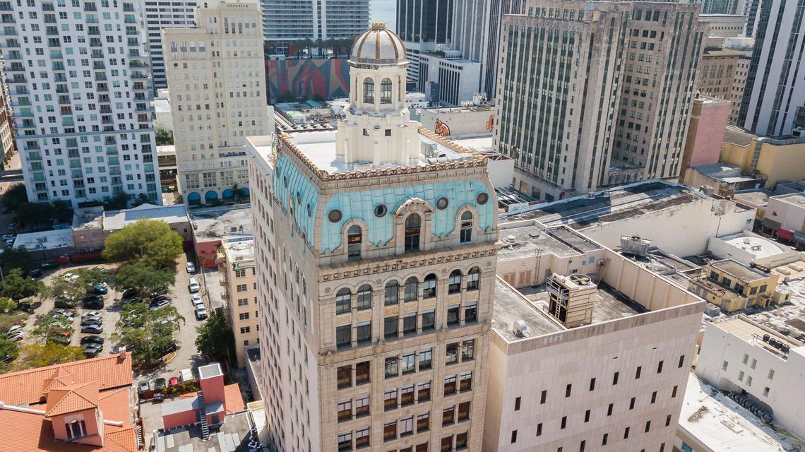 An aerial view of the Security Building, center, in downtown Miami on Wednesday, April 6, 2022. The building is being converted from the former home of WeWork to an office building fit for multiple firms.