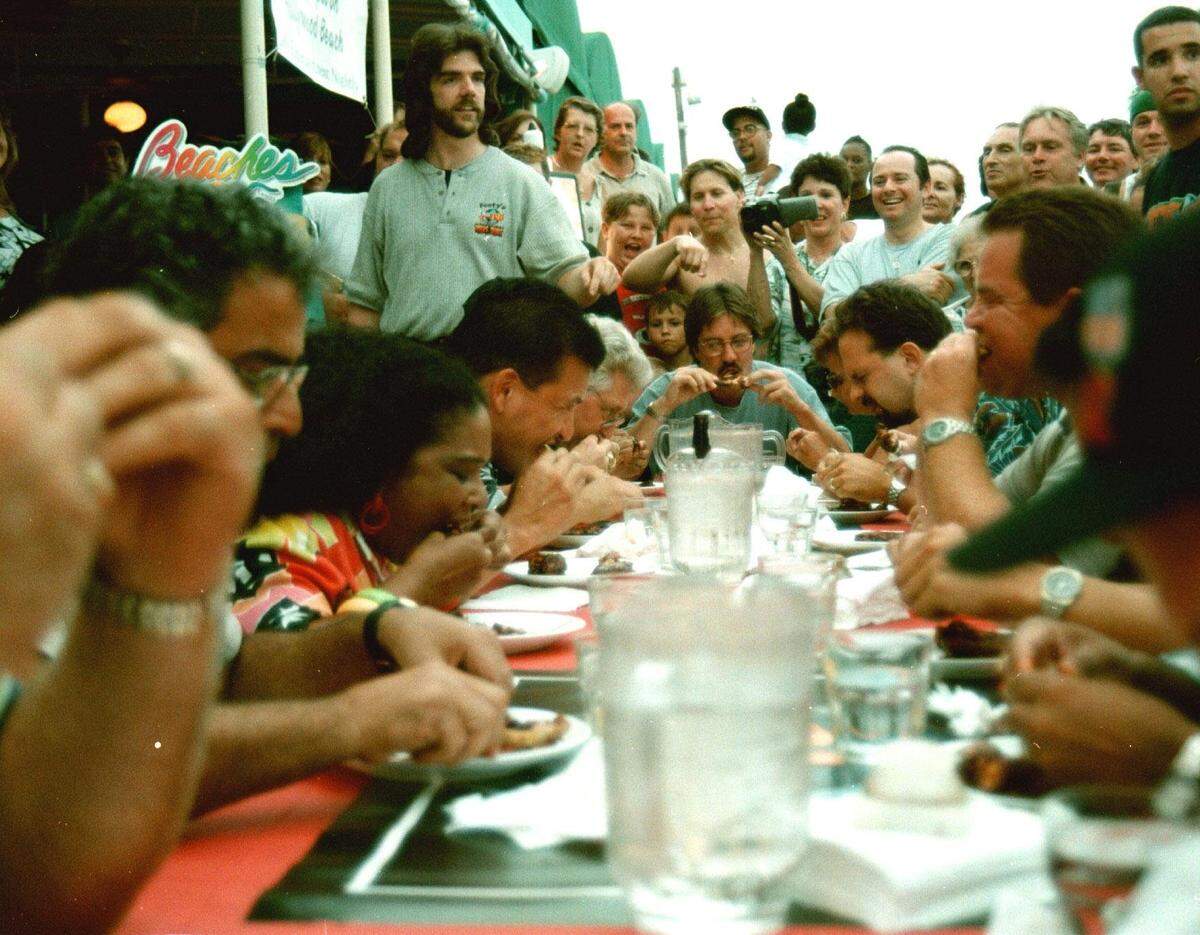 Footy and Y-100 sponsored a wing Pain Sauce Contest in Hollywood. Here, contestants chow down on spicy wings.