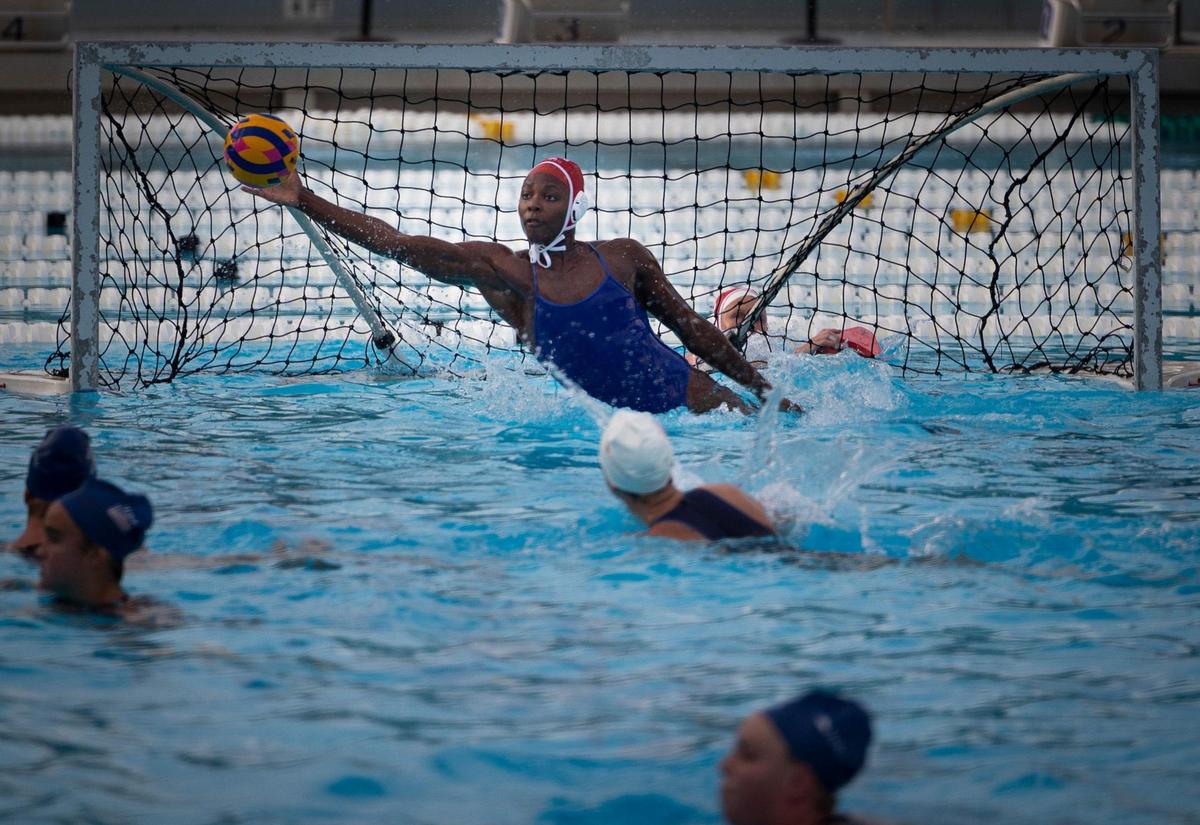 Ashleigh Johnson, 1, Team USA water polo goalkeeper, practices in the pool with the rest of the team on Tuesday, Dec. 5, 2023, at Ransom Everglades High School in Coconut Grove. Team USA has been training at Ransom in preparation for their upcoming matches that week against Spain.