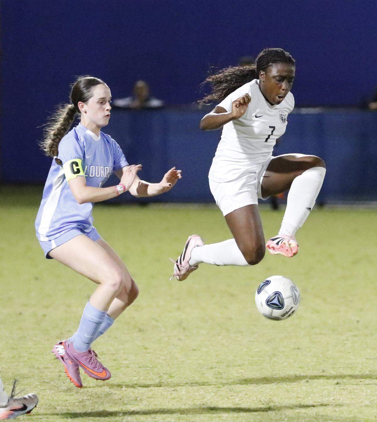 Pembroke Pines Charter’s Oreofe Soyode (7) chases the ball during the Region 4-5A final against Lourdes Academy on Tuesday, Feb. 17, 2026, at Miami Dade College’s Kendall Campus in Miami.