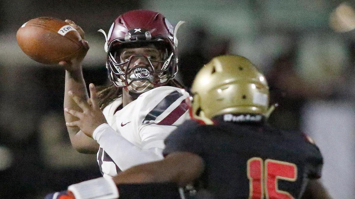 Norland Vikings quarterback Ennio Yapoor looks to throw during game against Monsignor Pace Spartans on Friday, September 16, 2022 at Monsignor Pace HS in Miami. Andrew Uloza / for Miami Herald