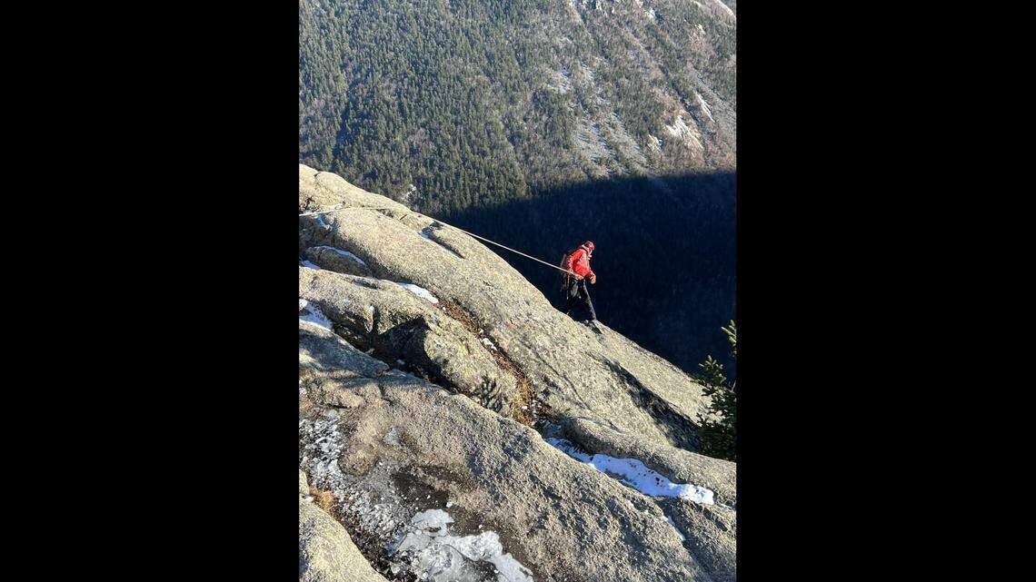 A hiker fell off of a mountain in a New Hampshire State Park while taking photos on the summit with his wife, according to state officials.