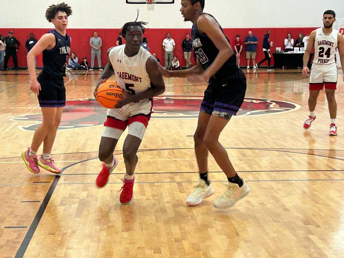 Sagemont’s Patrick Liburd, who led all scorers with 23 points, drives to the hoop during the Lions’ win over True North on Friday night at the Sagemont gym.