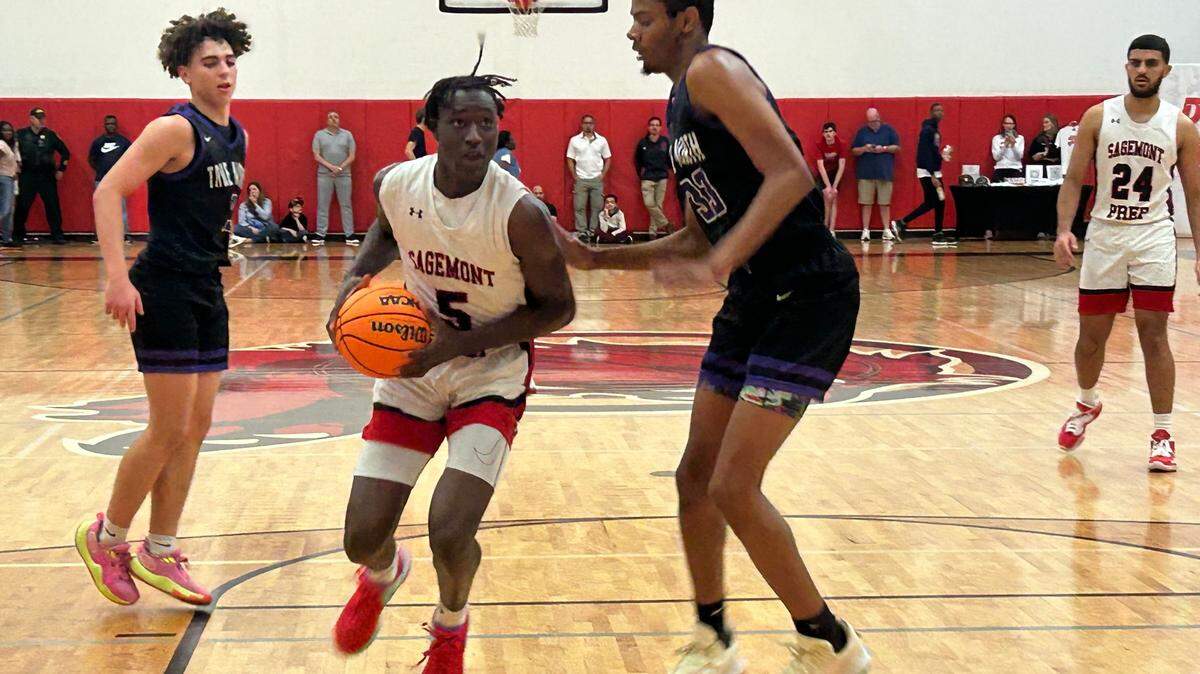 Sagemont’s Patrick Liburd, who led all scorers with 23 points, drives to the hoop during the Lions’ win over True North on Friday night at the Sagemont gym.