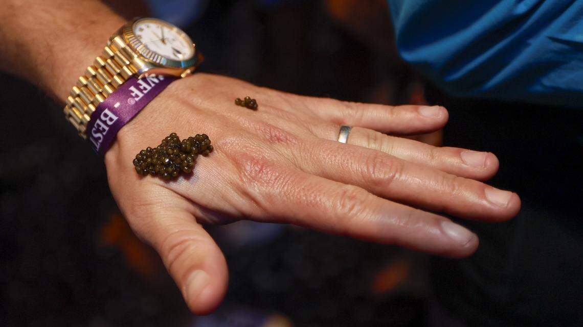 Bourbon Steak’s Assistant General Manager Christian Rodriguez serves caviar on the back of attendees hands as the Fontainebleau Miami Beach presents Wine Spectator's Best of the Best with 60 of the nation’s most acclaimed chefs and more than 65 of the world’s premier wineries at the resort hotel on Friday, February 20, 2026.