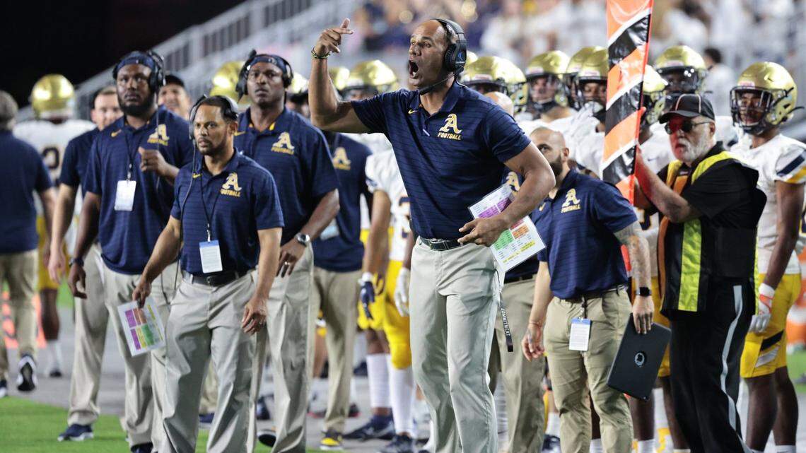St. Thomas Aquinas defensive coordinator Jason Taylor signals from the sidelines during game against Tampa Bay Tech in the FHSAA Class 7A State Championship at DRV PNK Stadium, in Fort Lauderdale on Friday, December 17, 2021.