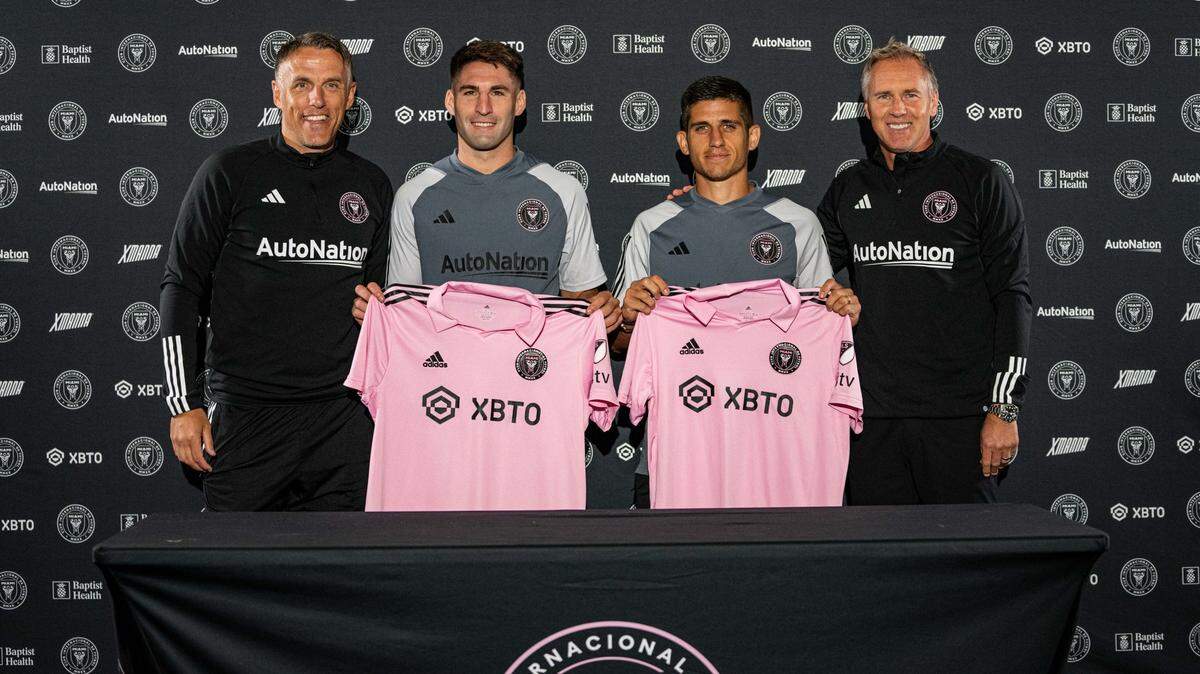 Inter Miami coach Phil Neville (left) and sporting director Chris Henderson (right) introduce new Argentine players Franco Negri (next to Neville) and Nico Stefanelli (next to Henderson).