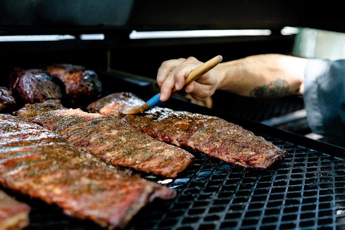 Garlic and honey spare ribs on the grill at Johnnie’s.