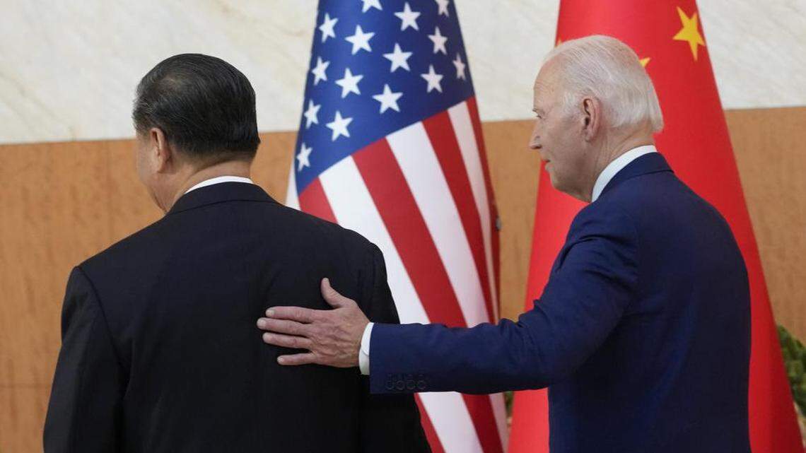 President Biden, right, walks with Chinese President Xi Jinping before their meeting on the sidelines of the G20 summit on Nov. 14, 2022, in Nusa Dua, in Bali, Indonesia.