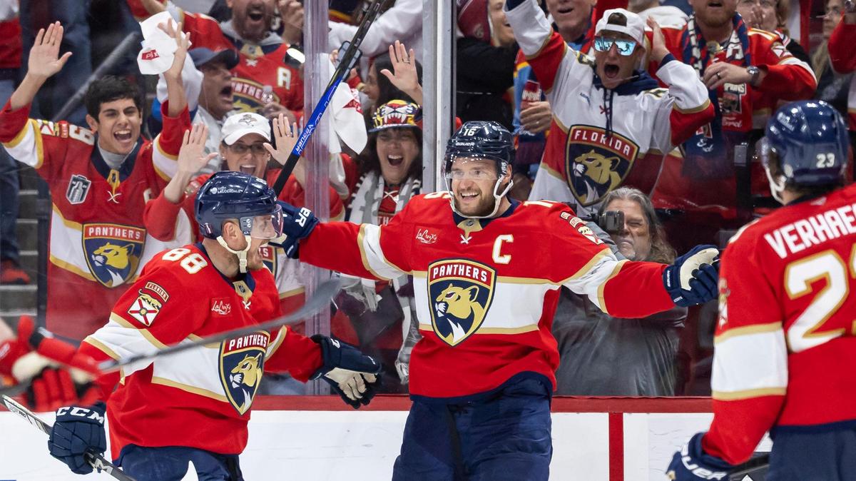 Florida Panthers center Aleksander Barkov (16) celebrates with his teammates after scoring against Carolina Hurricanes goaltender Pyotr Kochetkov (52) in the third period of Game 3 during the Eastern Conference final of the NHL Stanley Cup playoffs at Amerant Bank Arena on Saturday, May 24, 2025, in Sunrise, Fla.