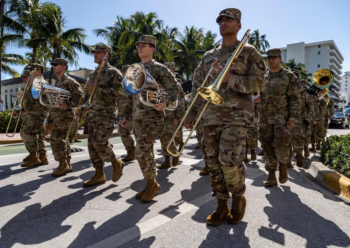 Members of a U.S. Army marching band lead the way at Miami Beach’s 14th Annual Veterans Day Parade Friday on Ocean Drive, from Fifth to 15th Street. The festivities also included an F-16 flyover and a picnic at Lummus Park.