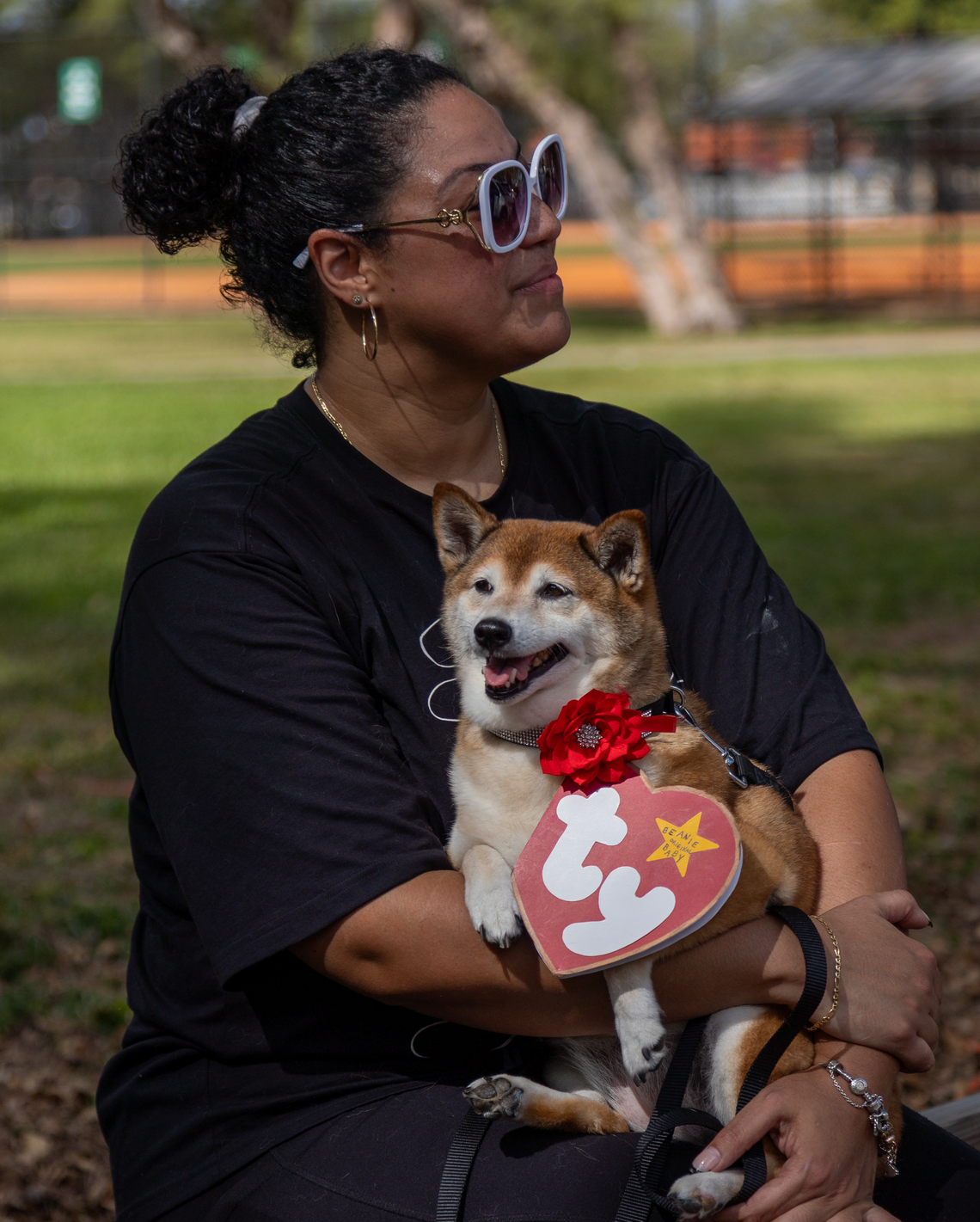 Nicole Nieves and Sasha, dressed as a Beanie Baby at the Pup Carnival at Tropical Park on Sunday.