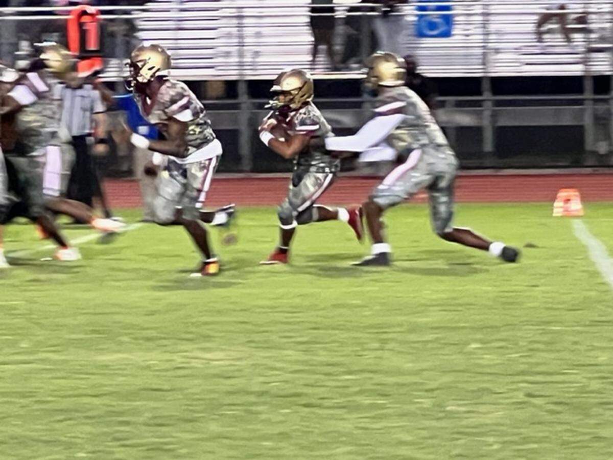 Coconut Creek running back Jamarie Hostzclaw (center) came back after missing the game against Plantation last week due to injury. Hostzclaw had a 3-yard touchdown run in the first half to help lead the Cougars to a 26-7 victory.
