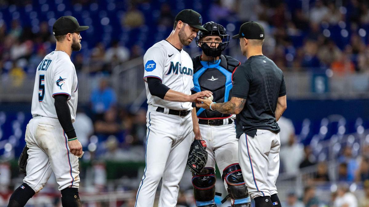 Miami Marlins pitcher Dylan Floro (36) is pulled by Marlins manager Skip Schumaker during the ninth inning of an MLB game against the San Diego Padres at loanDepot park in the Little Havana neighborhood of Miami, Florida, on Tuesday, May 30, 2023.
