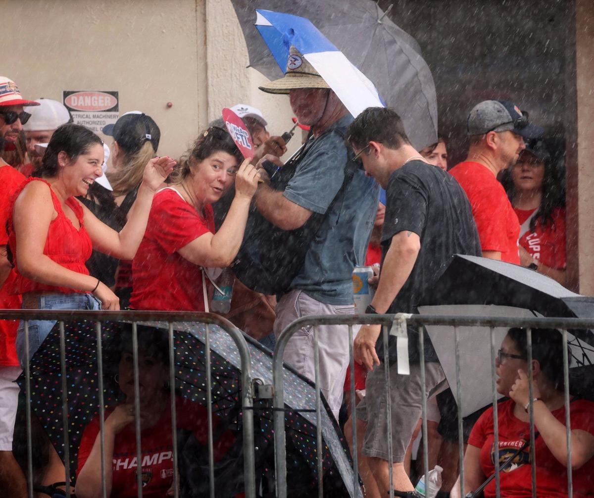The rain didn’t stop Panthers fans as they huddled under shelter before the Stanley Cup victory parade at Fort Lauderdale Beach on Tuesday, June 30, 2024 in Fort Lauderdale.&nbsp;