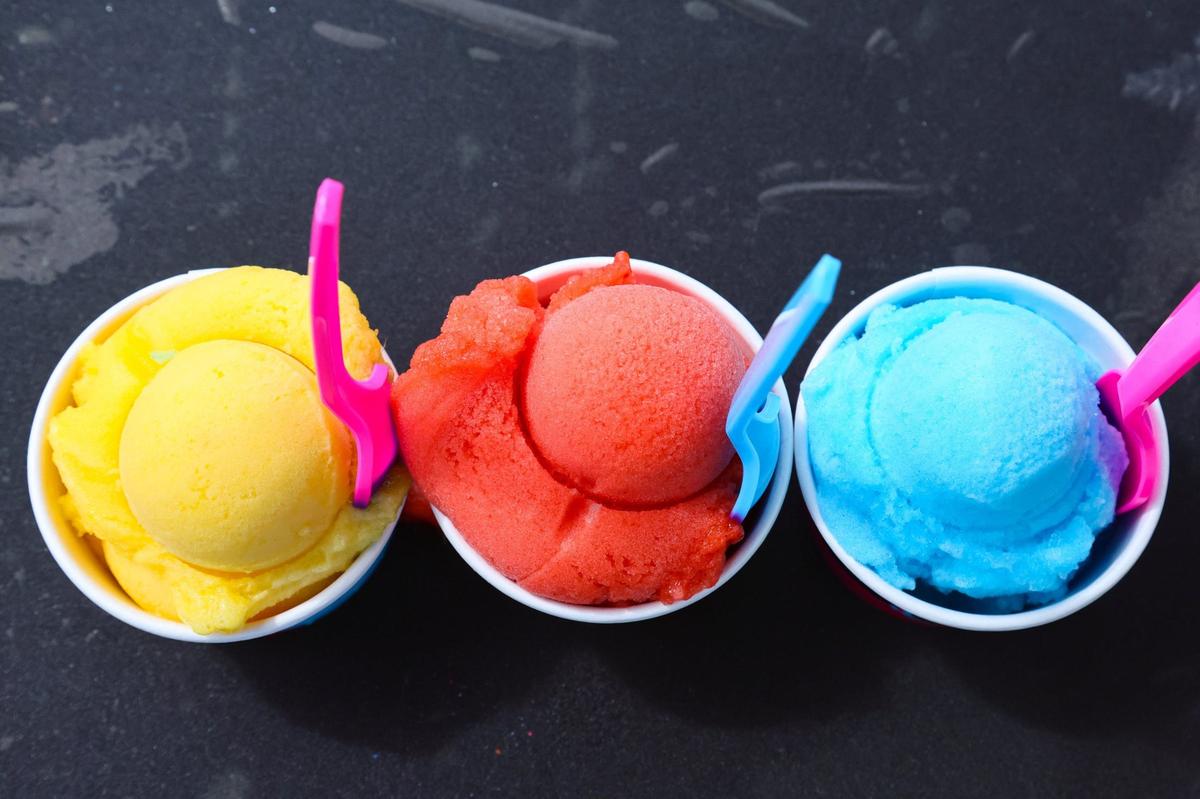 A detailed view of water ice flavors Mango Meek, Saweetie Strawberry and Nipsey Blue by Miami-based water ice company Italian Vice served by company owner Aamir Taylor during an interview by the Miami River in downtown Miami on Friday, Oct. 11, 2024.