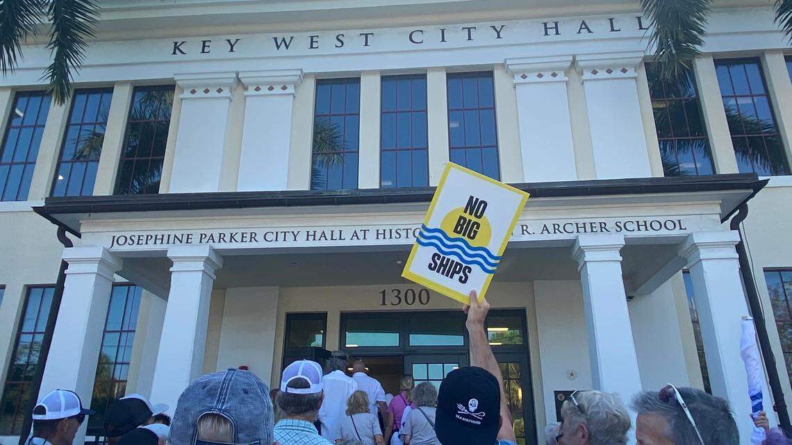 Key West residents file into City Hall to demand a reduction in cruise ship traffic.