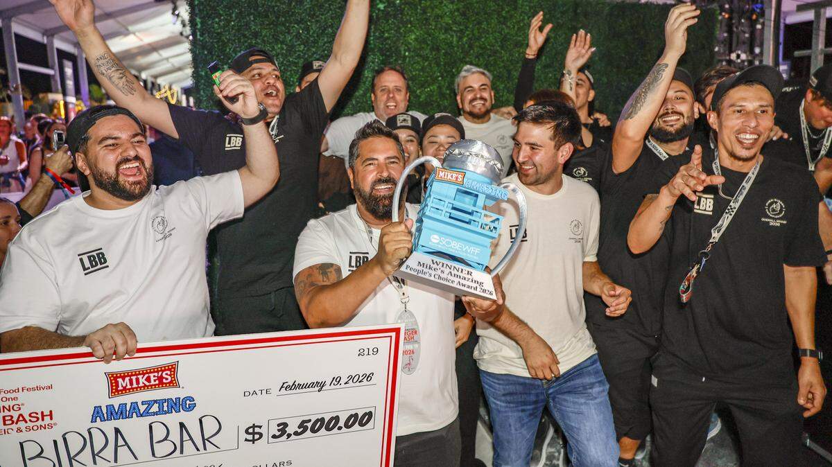Birra Bar wins as owner Daniel Cocchia hoists Mike's Amazing People's Choice Award Trophy during the annual Burger Bash hosted by Rachael Ray as burger restaurants compete to make the best burgers on Thursday, February 19, 2026.